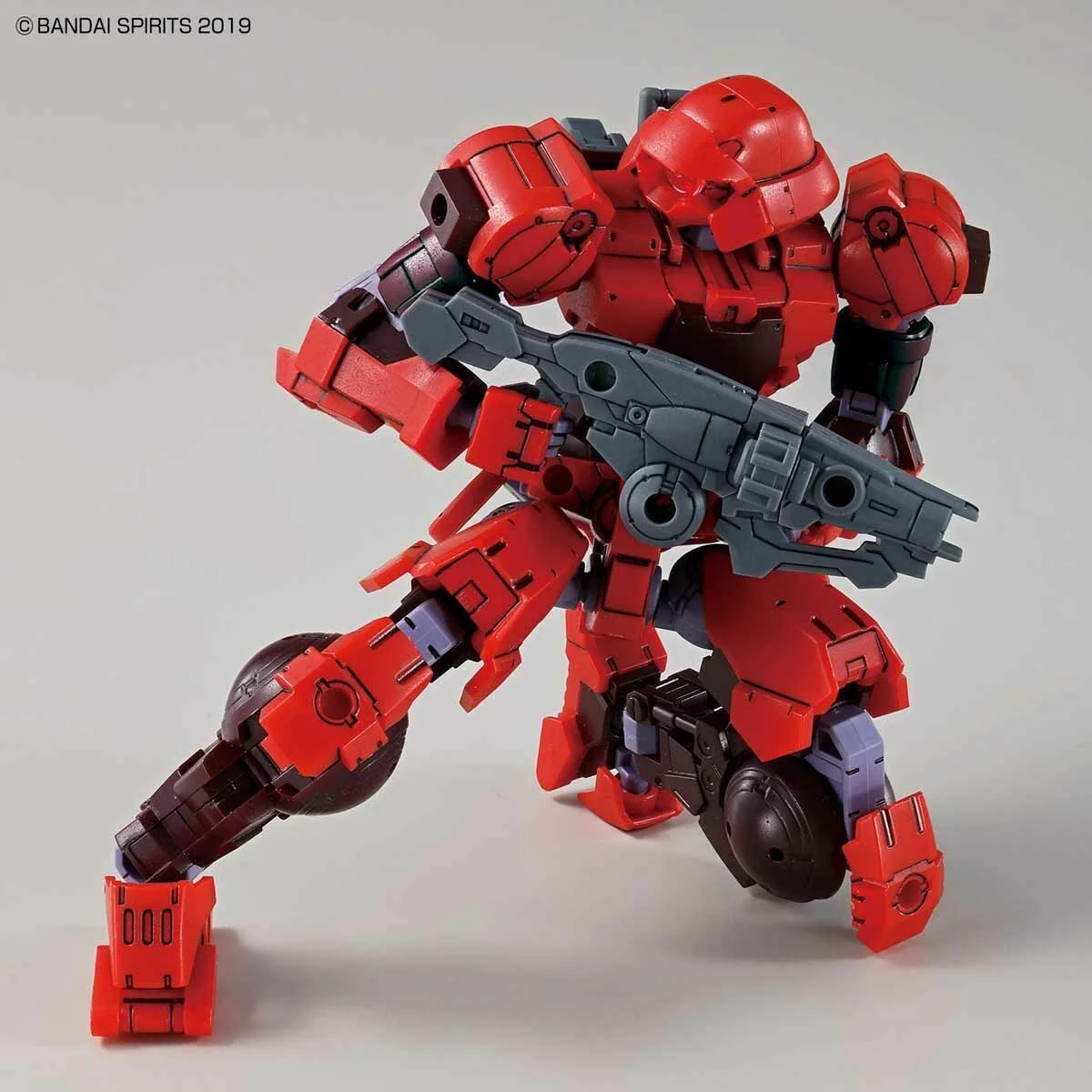 Bandai 30MM Portanova red model kit holding a rifle