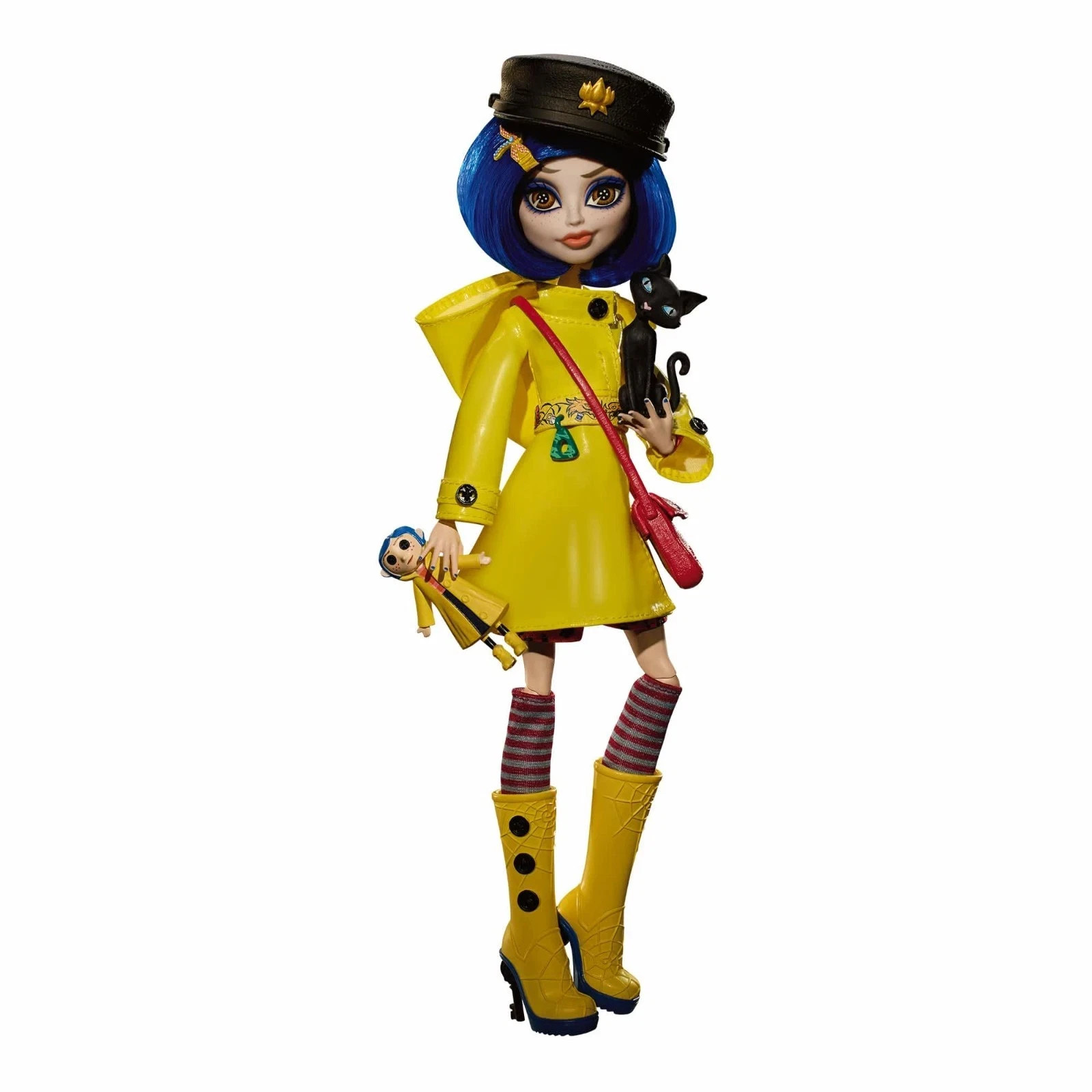 Monster High Skullector Coraline doll in yellow raincoat and black hat holding a black cat and doll